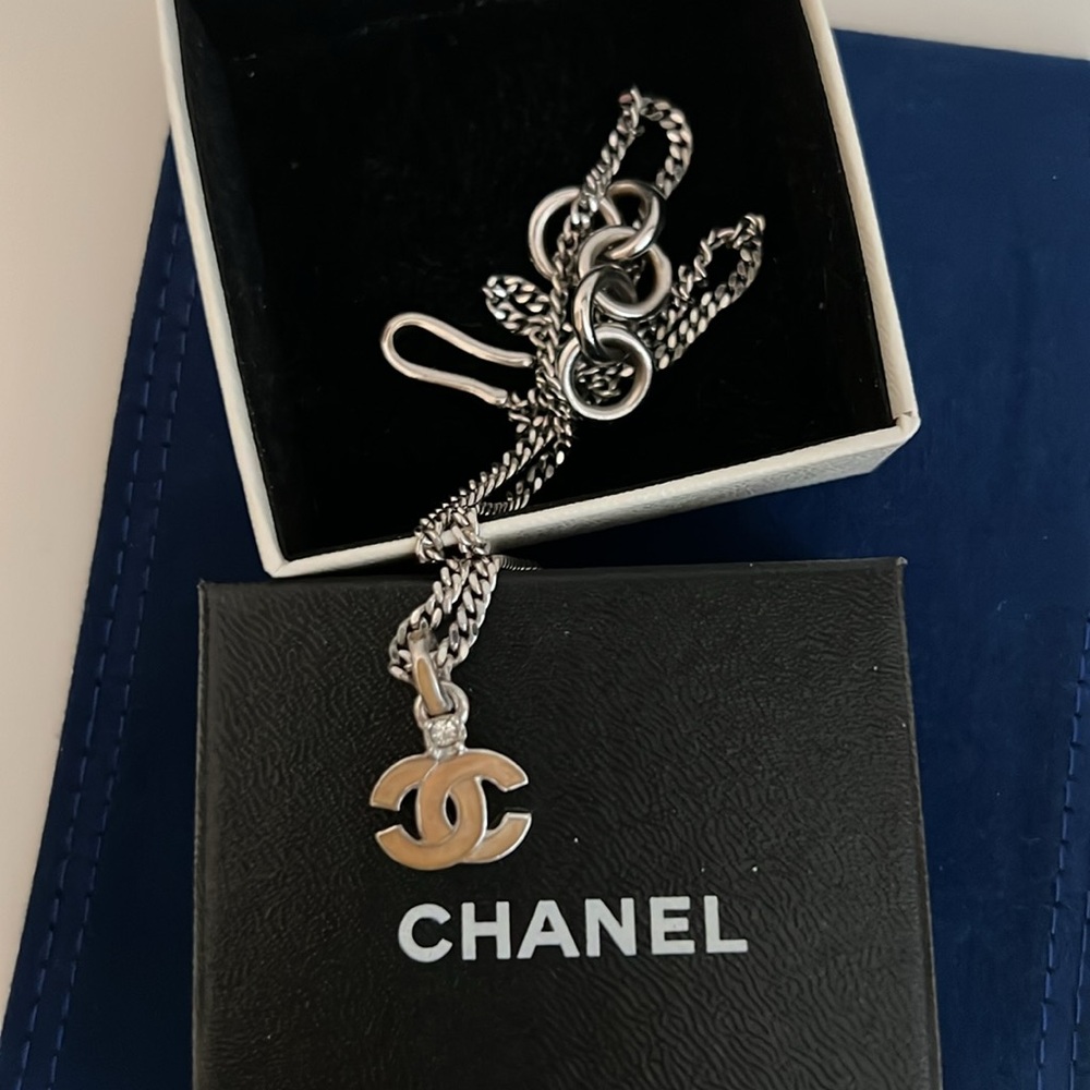 Authentic Chanel pendant necklace silver/pink and rhinestone. Perfect in Box
